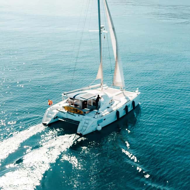 Benalmádena: Catamaran with dolphin watching and drinks - What’s actually on board: cava, snacks, Bluetooth music, and a fridge you’ll use