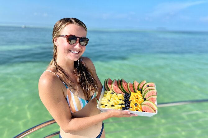 Biologist Owned & Operated: Dolphin Watching & Guided Snorkeling - Snacks, water, and comfort on the custom-built catamaran