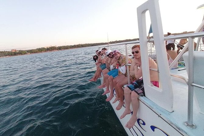 Blue Dolphin Catamaran Snorkeling Sunset Cruise from Tamarindo - Getting on, getting off, and staying comfortable on deck
