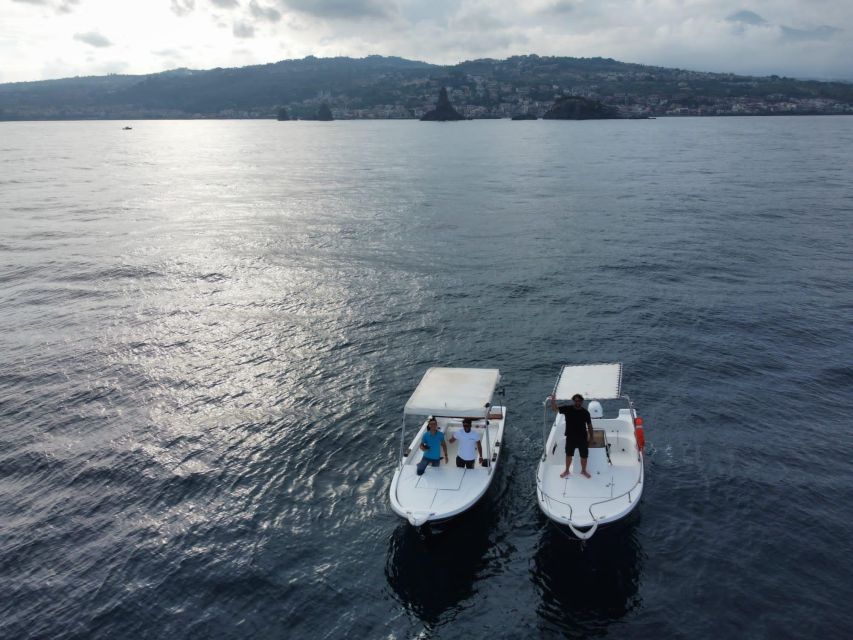 boat tour exploring and searching for dolphins in Acitrezza - Key highlights you’ll care about