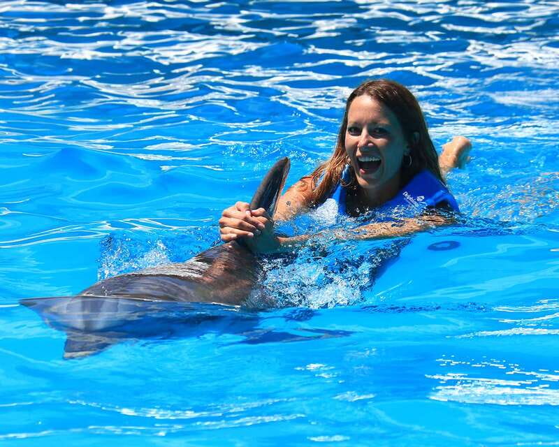 Cancun: Interactive Aquarium Ticket and Swim with Dolphins - Your Dolphin Host: Touch, Games, and the Dolphin Kiss Moment
