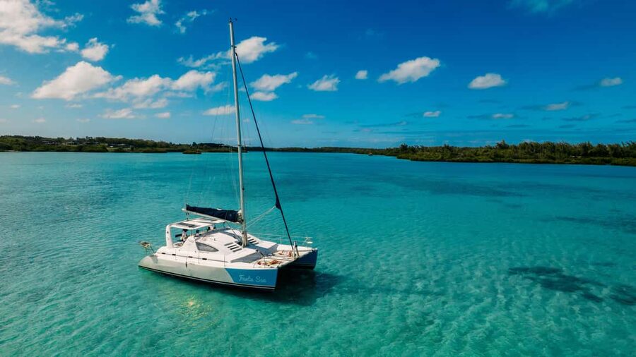 Catamaran Cruise to île aux Cerfs w Dolphins watch & Lunch - From the jetty by the Mauritian flag to open water