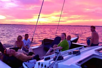 Condor Sailing Fun, Relaxing Public Dolphin & Sightseeing Cruise - Stop One: Fort Pickens views and side-seating with foot-dangling energy