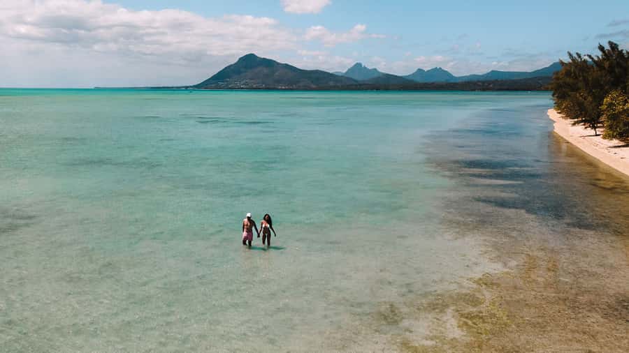 Île aux Bénitiers: Snorkeling w/Dolphins Boat Tour & Lunch - Crystal Rock snorkeling with Le Morne in the background