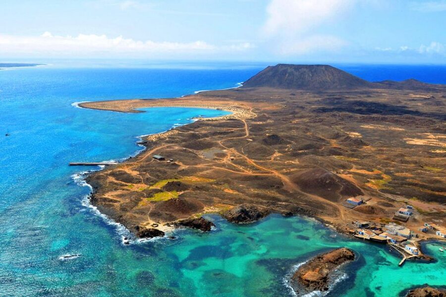 Lanzarote: Lobos Island Half-Day Dolphin Watching Trip - Lobos Island: swims, volcanic trails, lagoons, and no time to waste