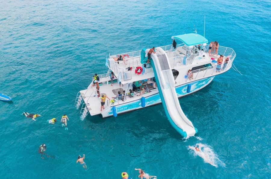 Oahu: Dolphin Watching & Turtle Snorkeling with Waterslide - On the Boat: E Ho Mai Chant, Spinner Dolphins, and a Lively Crew