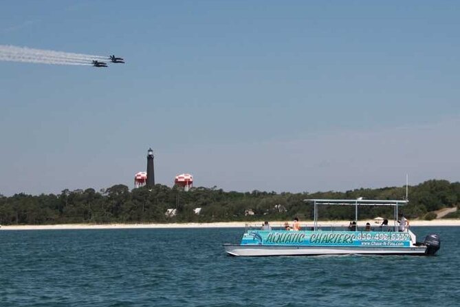 Pensacola Beach Dolphin and Scenic Tour - Naval Live Oaks Reservation: calm water, trees, and more dolphin time
