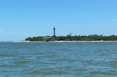 Private Dolphin & Sightseeing Boat Day Tour - Crossing toward Sanibel and photographing the lighthouse