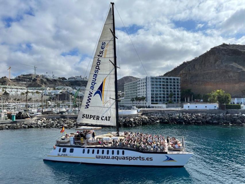 Puerto Rico de Gran Canaria: Premium Dolphin Catamaran Tour - Lunch, open bar, and the banana boat activity