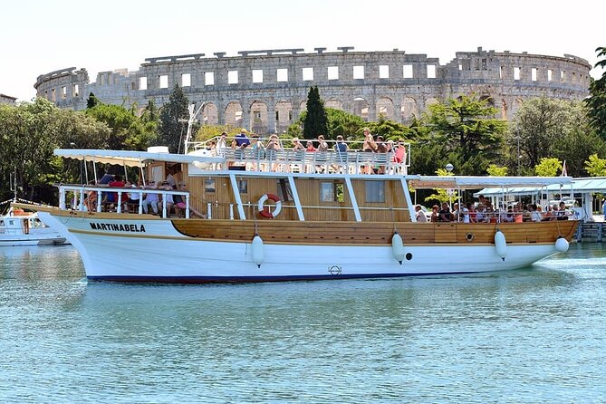 Sunset Dolphin Cruise in Brijuni National Park from Pula - Sailing Out of Pula: Arena Pula and Uljanik Shipyard from the Water