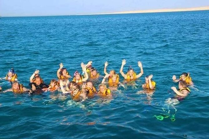 Swimming with Dolphins and Banana Boat Sea Trip Day Experience - Hurghada - Snorkeling at two coral reef spots: gear, comfort, and reef viewing