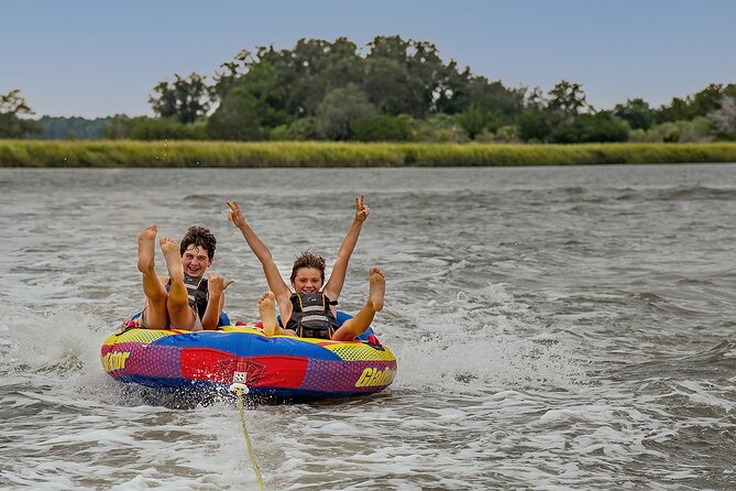 Tubing and Dolphins Up to 6 Guests - The tubing pull: big fun with safety handled by the captain